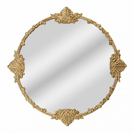 Ogledalo s okruglim ukrašenim zlatnim okvirom